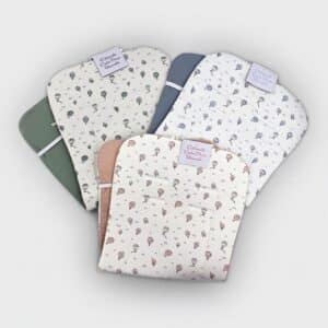 Colchoneta reversible globo y liso Marca DENENE.